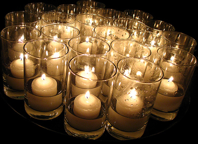 Magnolia candles ready to go out onto tables.