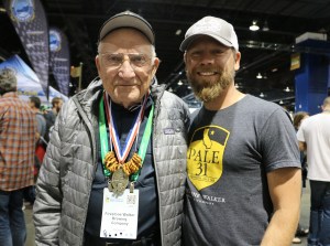 Brewmaster Matt Brynildson of Firestone Walker lets his grandfather wear the medal around the hall..
