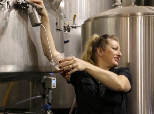 Brewer Cat Wiest leads a tour and offers fermenter samples